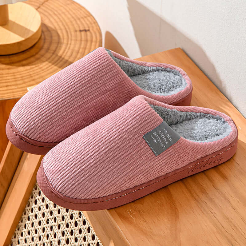 Home Indoor Wear-resistant Non Slip Cotton Slippers in calibration pink color with soft artificial wool lining.