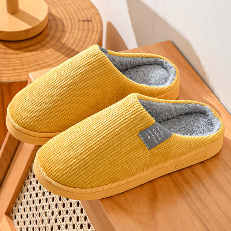 Home Indoor Wear-resistant Non Slip Cotton Slippers in yellow with artificial wool lining and striped pattern.